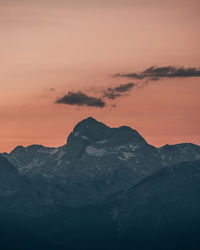 Scenic view of snowcapped mountains against sky during sunset