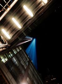 Low angle view of illuminated lights at night