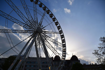 Low angle view of ferris wheel against sky