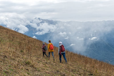 A family walking up the mountain