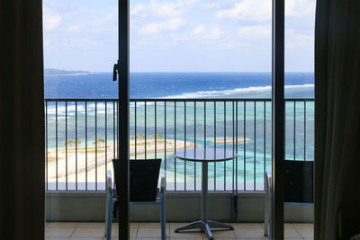 Scenic view of sea seen through window