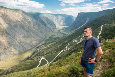 Portrait of man standing on mountain