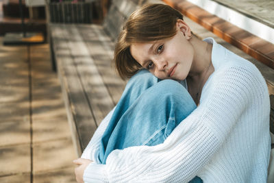 Side view of young woman looking away