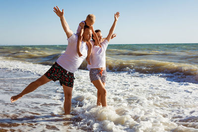 Happy family having fun on summer vacation.