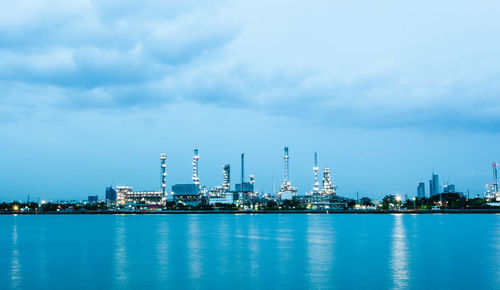 View of factory against blue sky