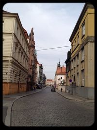 Road leading towards buildings