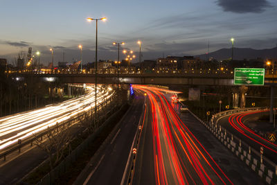 High angle view of light trails on road at night