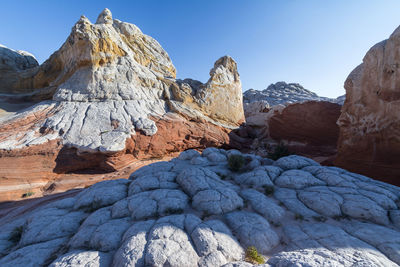 Rock formations on mountain against sky