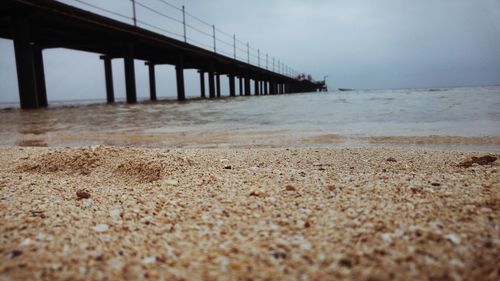 Pier over sea against sky