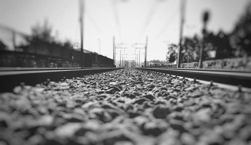 Surface level of railway tracks against clear sky