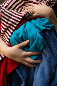 Midsection of woman with baby sleeping