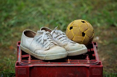 Close-up of shoes on field