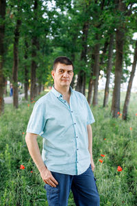 Portrait of man standing on field