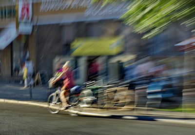 Blurred motion of cars on road