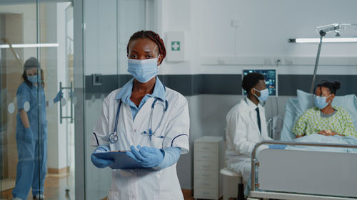 Portrait of female doctor wearing mask in hospital