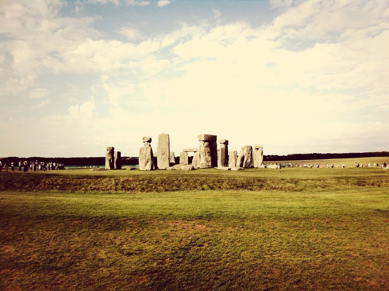 architecture, built structure, grass, building exterior, sky, history, field, the past, cloud - sky, old ruin, landscape, ancient, travel destinations, famous place, day, outdoors, grassy, no people, cloudy, old