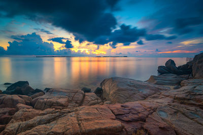 Scenic view of sea against sky at sunset