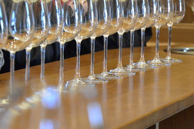 Close-up of wineglasses arranged on bar counter