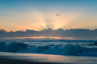 Scenic view of sea against sky during sunset