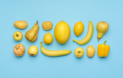 High angle view of fruits against blue background