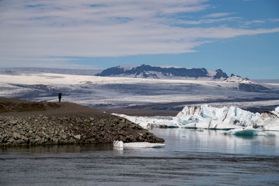 Scenic view of sea against sky during winter