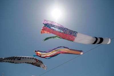 Low angle view of kite flying against clear sky