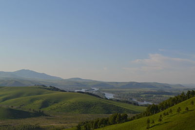 Scenic view of agricultural field against sky