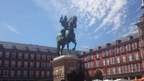 Low angle view of statue in city