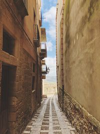 Narrow alley along buildings