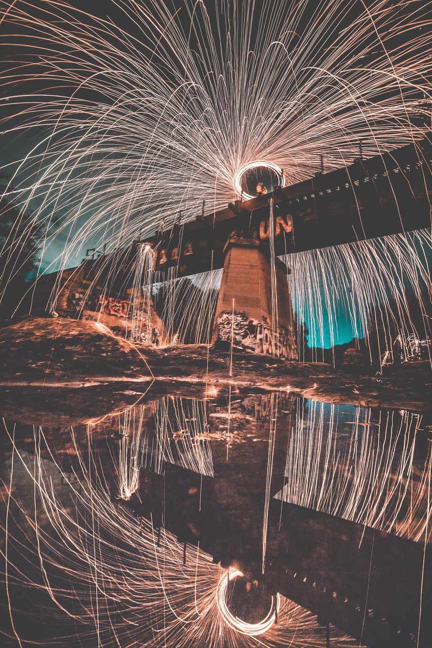 long exposure, night, illuminated, motion, spinning, wire wool, reflection, blurred motion, water, firework display, light trail, outdoors, firework, no people, standing, sky