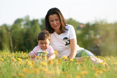 Happy mother and son on field