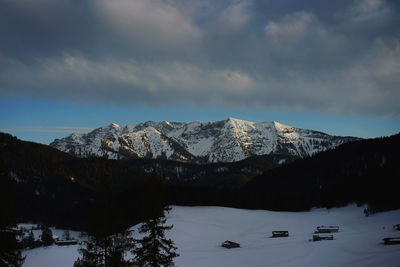 Scenic view of snowcapped mountains against sky