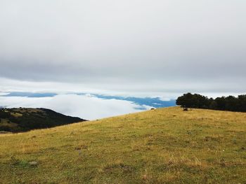 Scenic view of sea against cloudy sky