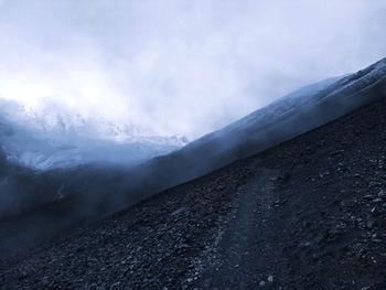Scenic view of mountains against sky during winter