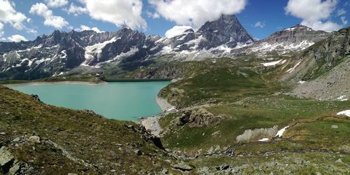 Scenic view of mountains and lake against sky