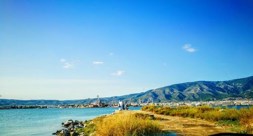 Scenic view of sea against blue sky