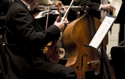 Midsection of musicians playing music