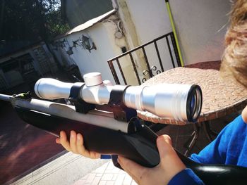 Close-up of hand holding camera