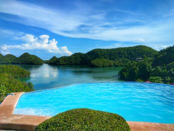 Scenic view of swimming pool against sky