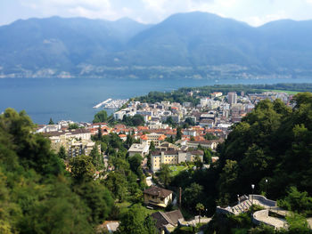 High angle view of townscape by sea