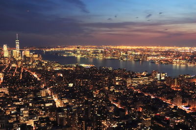 Aerial view of city lit up at night