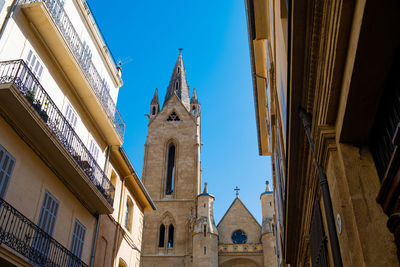 Low angle view of buildings against sky in city