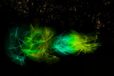 Close-up of light painting against black background