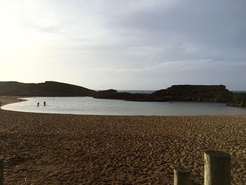 Scenic view of sea against cloudy sky
