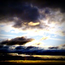 Low angle view of cloudy sky at sunset