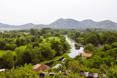 Scenic view of landscape and mountains against clear sky