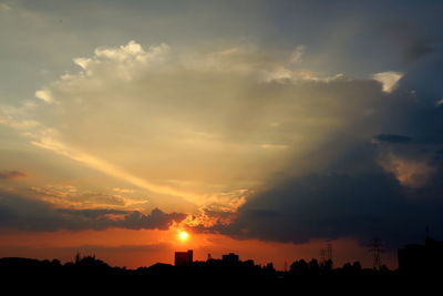 Silhouette landscape against scenic sky