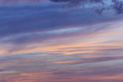 Low angle view of cloudy sky at sunset