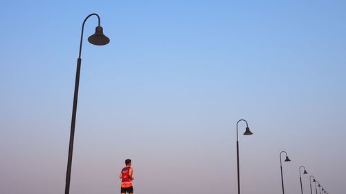 Low angle view of street light against clear sky