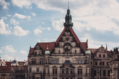 View of buildings in city against sky